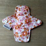 Narancs virág tisztasági mosható betét 16cm (piskóta forma)